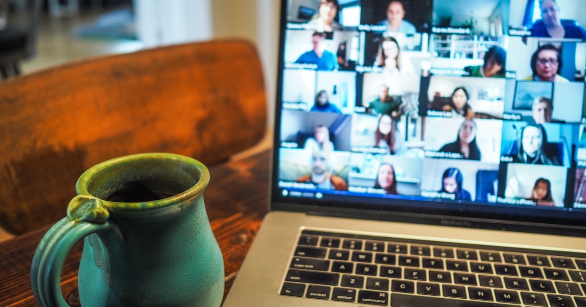 Filipino virtual assistant handling chat support on a laptop from a home office setup