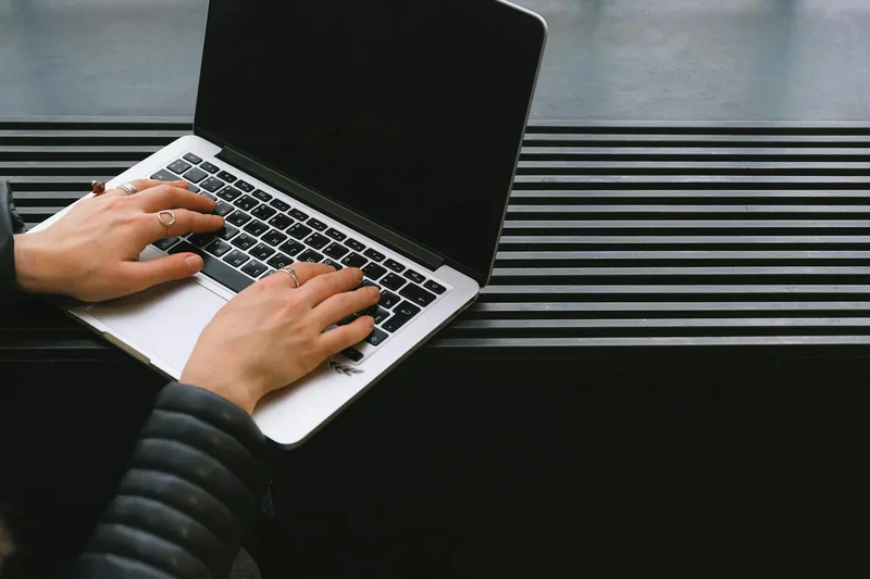 Person searching for VA job listings on a laptop