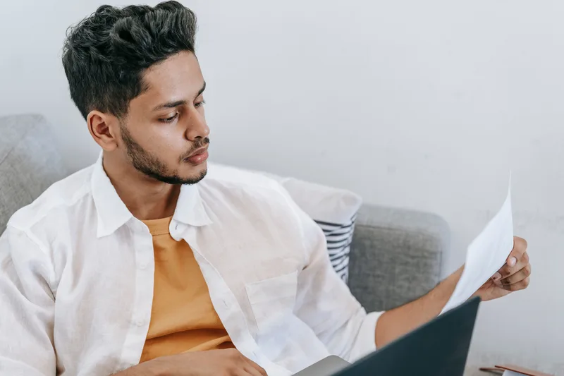 Reviewing hiring and compliance paperwork before onboarding a remote team member