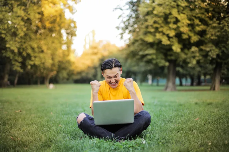 Virtual assistant celebrating after landing a new remote job offer