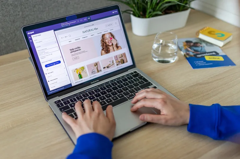 Hands typing on a laptop showing ecommerce product tasks representing part-time VA work skills