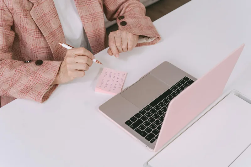 Filipino VA reviewing salary and job listings on a laptop